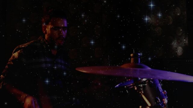 Drummer reaching for cymbal and launching snare or tom rhythm, starry overlay signaling vocalist ent
