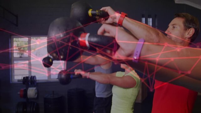 Fitness group performing swings, hip hinging initiating red overlay and kettlebells moving forward
