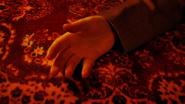 Man Falls On Persian Rug In Firelight
