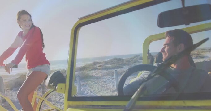 Woman pedaling yellow bike, glancing back, man driving yellow buggy smiling, sharing travel moment