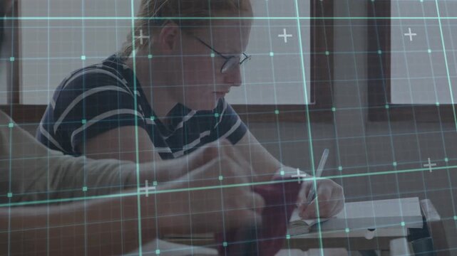 Student writing notes while peer taking maroon case starting help grid overlay aiding learning