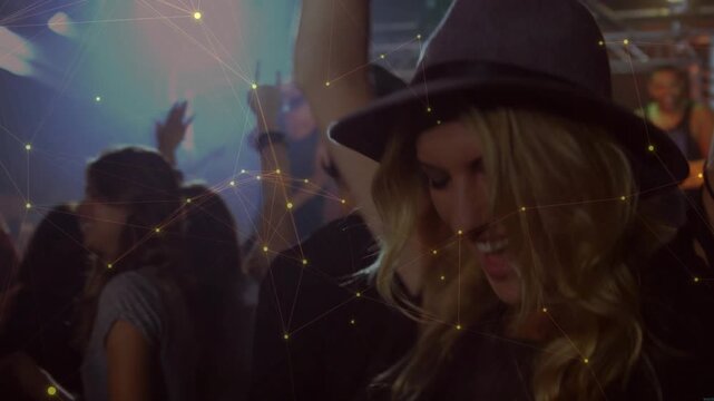 Hatted woman dancing at concert responding to live music as pulsing lights animating yellow sparks