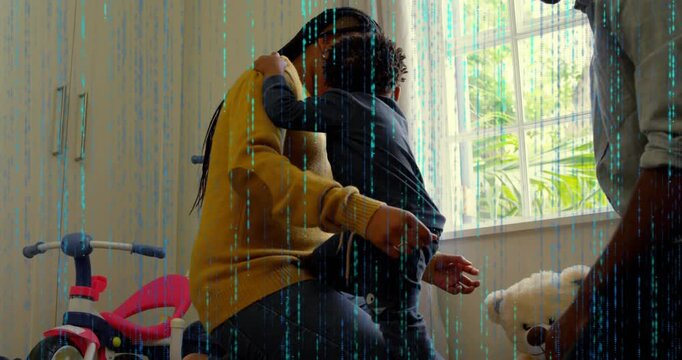 Vertical video: Mom holding kid after climbing into lap while dad fixing clothes, parenting trike