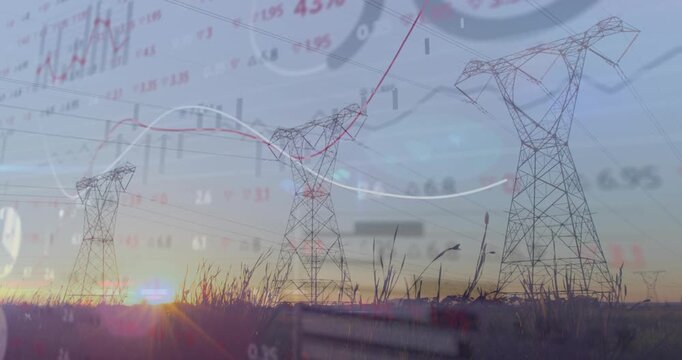 Towers standing in rural dusk, sun low causing lens flare and financial lines sweeping across