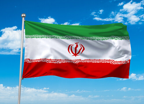 Flag of Iran waving in the blue sky.