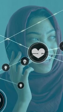 Vertical video: Call sparking tech heart idea network filling view over woman on phone sharing joy