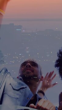 Vertical video: Main subject raising left arm while crowd raising hands, reacting to moment above