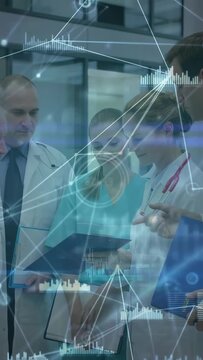 Vertical video: Clinicians leaning in reviewing charts while nurse showing tablet, HUD guiding plan