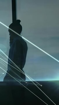Vertical video: After call ending silhouette moving along ledge as net lines sweeping showing flow