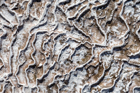 Travertine rock surface with intricate patterns