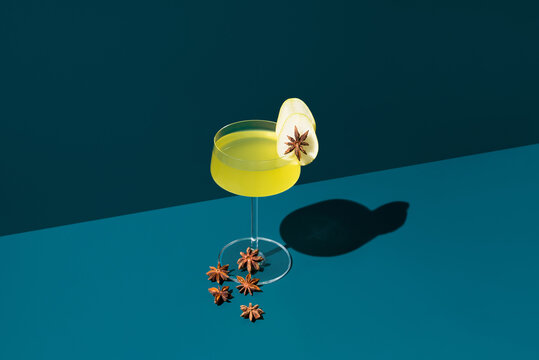 Herbal liqueur with pear slice and star anise