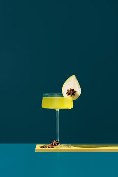 Herbal liqueur with pear and star anise garnish