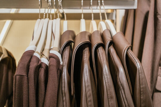 Elegant display of brown jackets in a clothing store