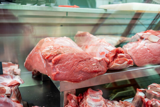 Fresh cuts of meat on display at a butcher's shop