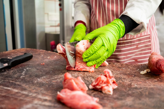 Butcher preparing fresh meat with precision