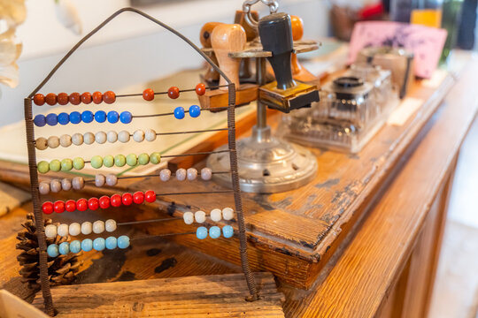 Vintage abacus and stamps on a wooden desk
