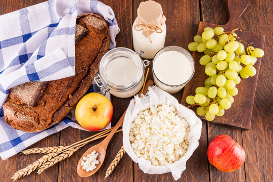 Shavuot celebration with traditional dairy and fruits