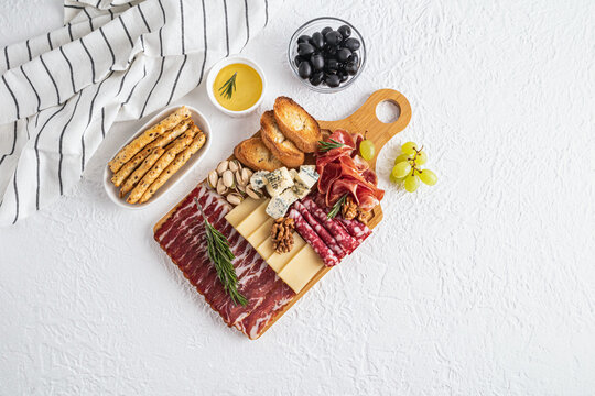 Gourmet cheese platter with meats and accompaniments