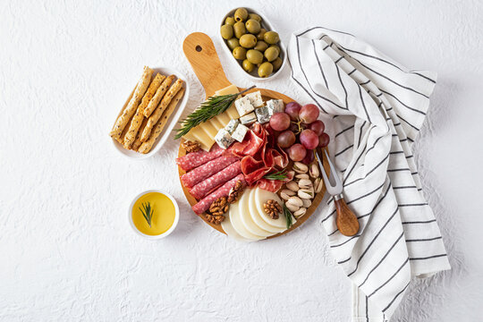 Gourmet cheese platter with assorted delicacies