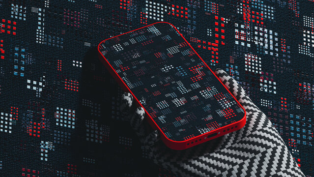 Hand holds mobile device against textured wall surface