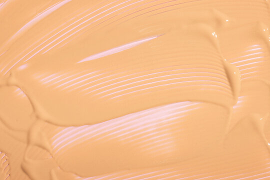 Smooth texture of liquid foundation cream close-up