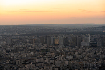 Fototapeta premium Paris, France - 03 03 2026: Montparnasse Tower: View of buildings and skyscrapers at sunset from the rooftop