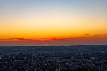 Paris, France - 03 03 2026: Montparnasse Tower: View of buildings and skyscrapers with the sun at sunset from the rooftop