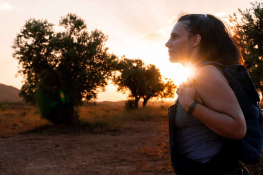 Hiker at sunrise near The Sinkhole of Los Aines