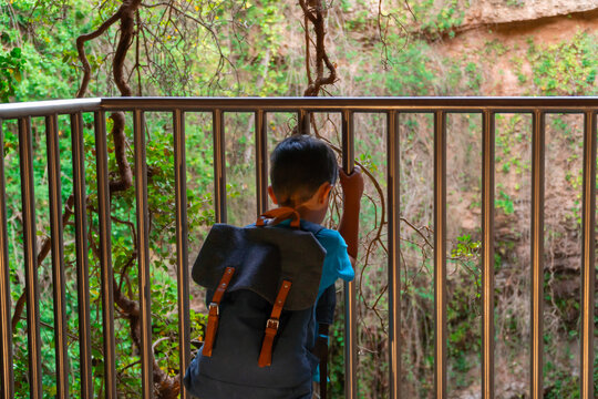 Hiker exploring the sinkhole of Los Aines