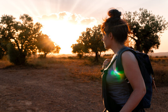 Hiker explores the surroundings of the Sinkhole at sunset.