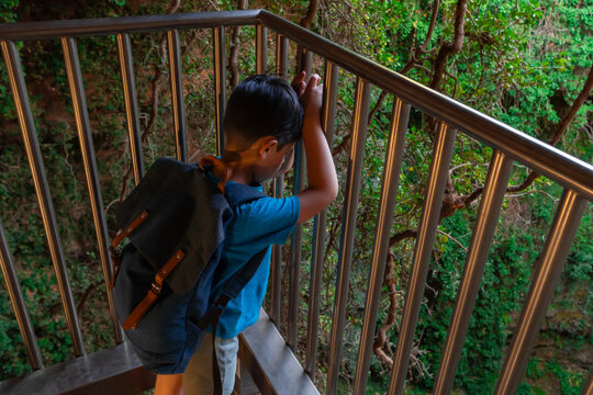 Hiker overlooking The Sinkhole of Los Aines