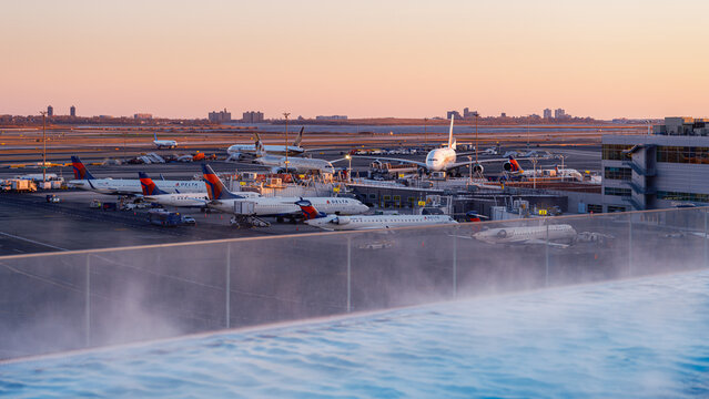 Delta aircraft and airport operations viewed from the rooftop pool at TWA Hotel, JFK International Airport, New York