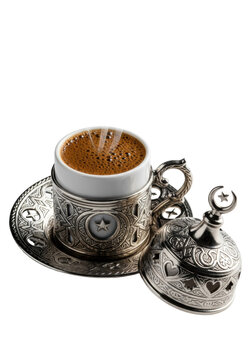 Macro shot of rich, steaming turkish coffee in an ornate antique silver zarf with ottoman patterns and celestial cutouts on a transparent background. Concept of luxurious cultural ritual