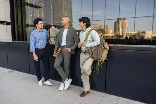 Businessmen chatting in urban setting