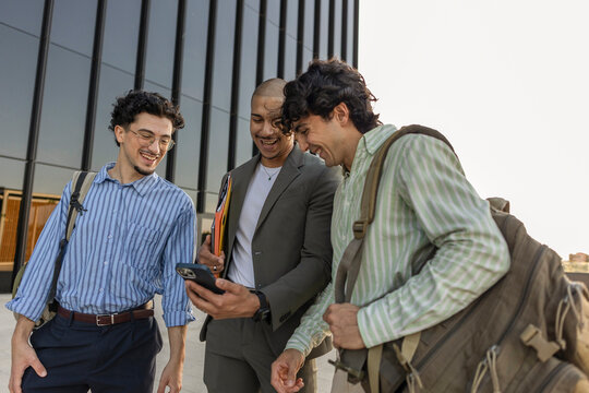 Businessmen discussing ideas in a modern cityscape