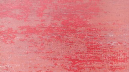 Fototapeta premium Faded Red Wooden Surface Texture Background. Worn red wooden surface with subtle grain and distressed texture detail