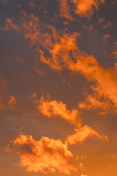 Dramatic sunset sky with vibrant orange clouds