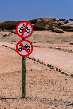 Desert landscape with prohibition signs in Namibia