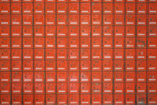 Red post office boxes with numbered labels