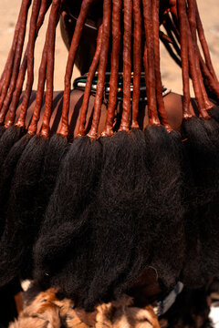 Intricate hairstyle of Himba woman in Namibia