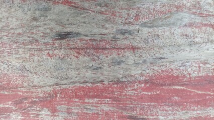 Obraz premium Distressed Red Painted Wood Background. Close up of worn red paint over natural wood grain, textured rustic surface