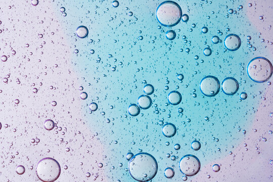 Textured bubbles on gradient background in petri dish
