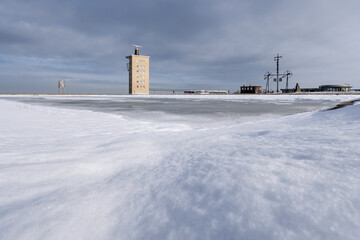radar tower and wind semaphore in Cuxhaven, Germany at the river Elbe on a frosty winter day