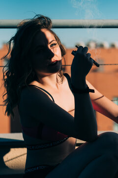 Woman enjoying a cannabis joint on a sunny day