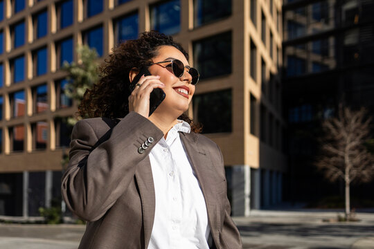 Businesswoman making a phone call in the city