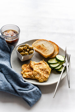 Keto breakfast with Greek olives and cucumber slices
