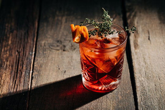 Classic cocktail on rustic wooden bar table