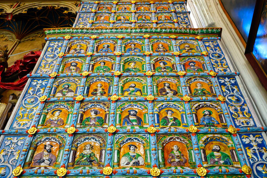 Decorative historic ceramic tiled stove with historical portraits of European rulers at the Artus Court in Gdansk, Poland