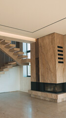 Naklejka premium Modern interior design featuring a floating staircase and a stone fireplace with ambient lighting