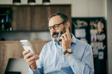 Man connecting with phone in modern home